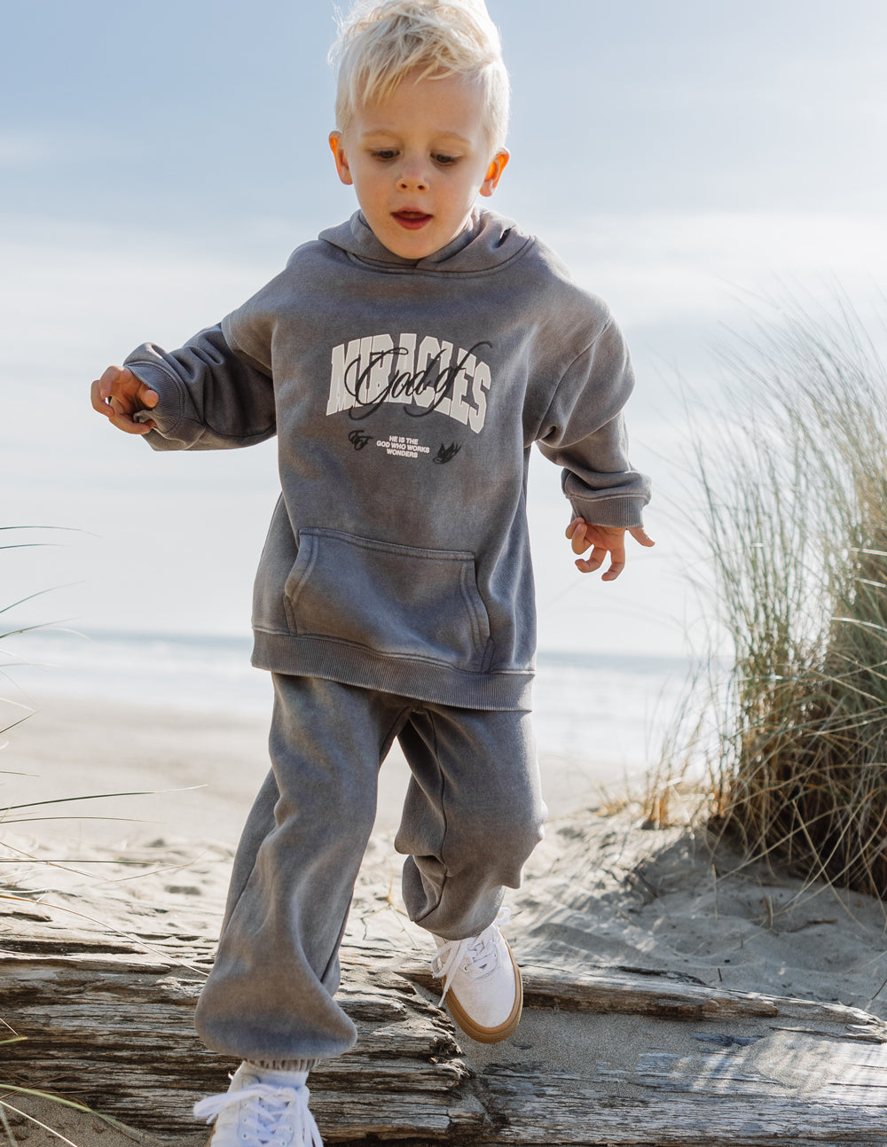 Kids dark gray hoodie with hood, printed chest graphic, and kangaroo pocket