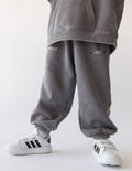 Kids grey sweatpants with cuffed hems and small thigh logo print