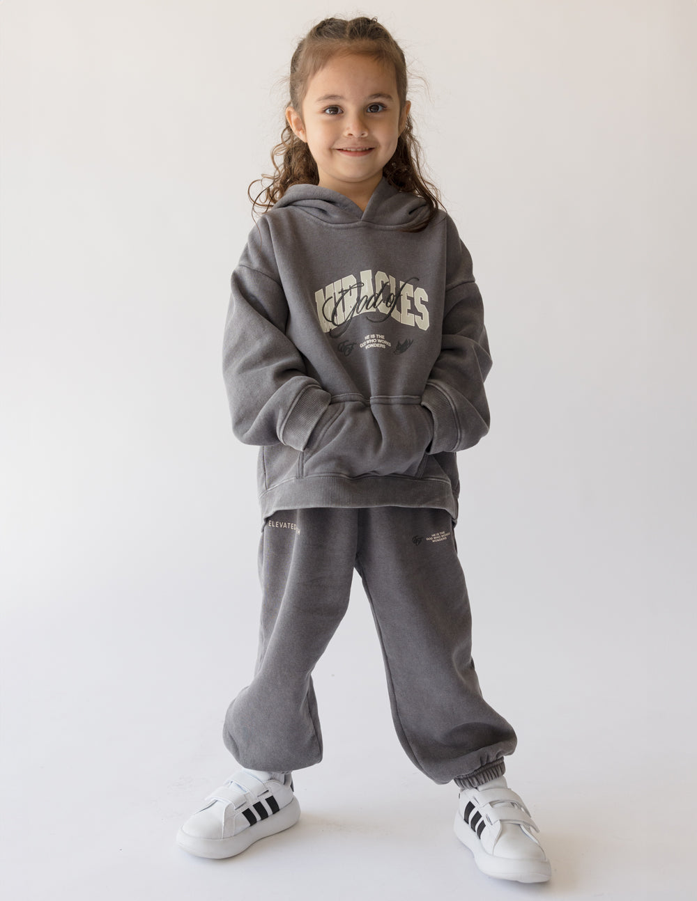 Kids grey sweatpants with cuffed hems and small logo on thigh