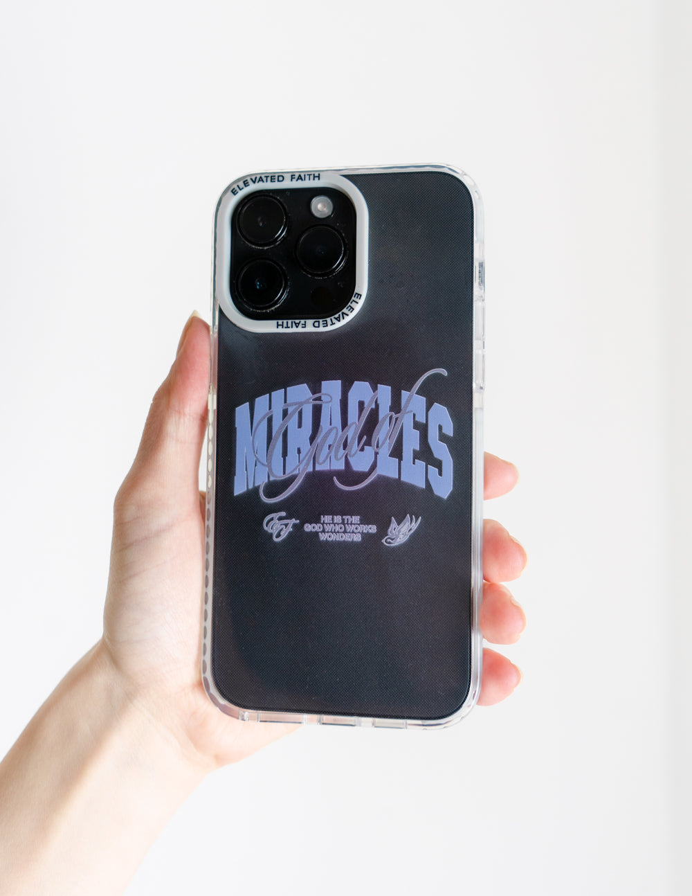 Black phone case with blue “Miracles” lettering and clear protective bumper
