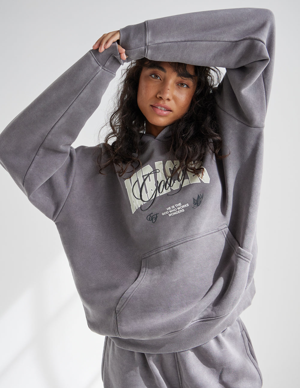 Grey unisex hoodie with front kangaroo pocket and hooded neckline