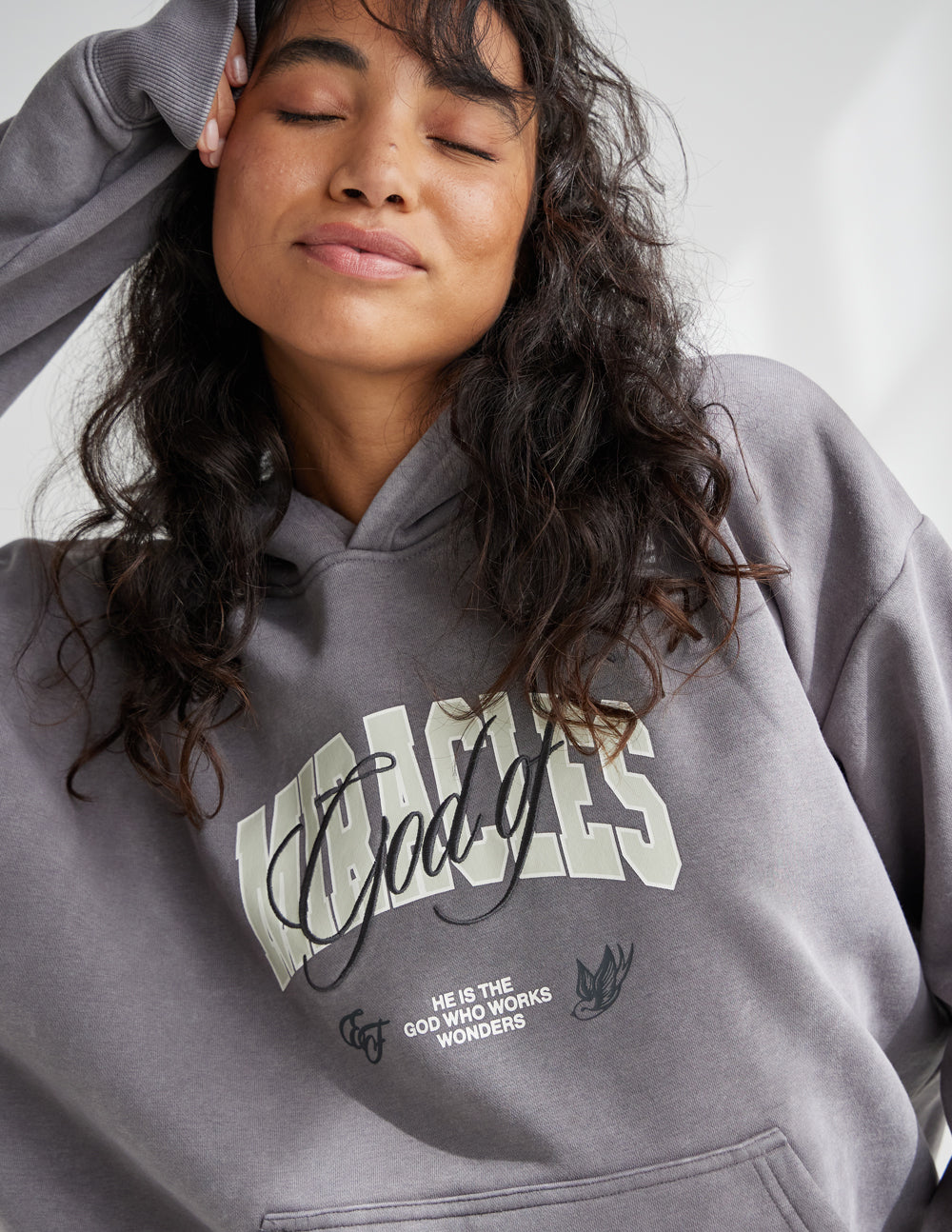 Grey hoodie with front graphic logo, hood up and kangaroo pocket