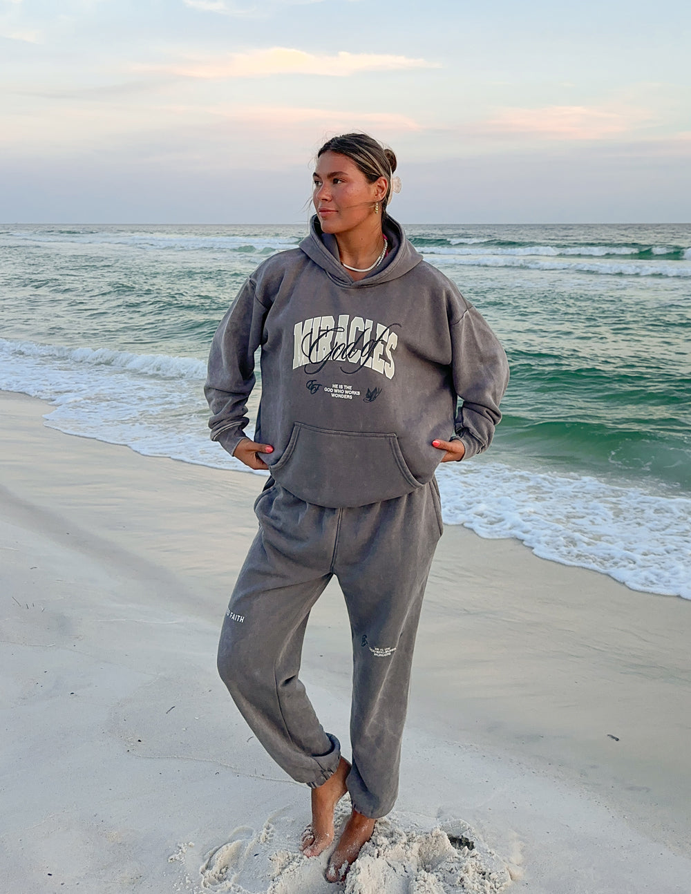Grey unisex hoodie with front script logo and front kangaroo pocket