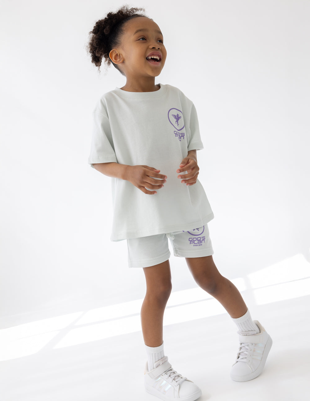 Kids racing T-shirt set in white with purple logo on chest; matching shorts included