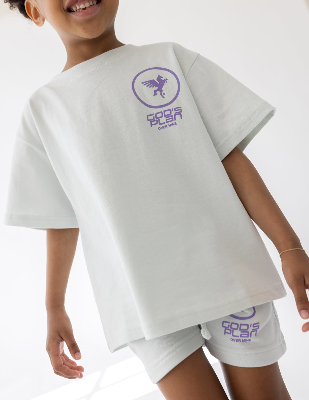 Kids racing T-shirt in white with purple chest logo and small graphic