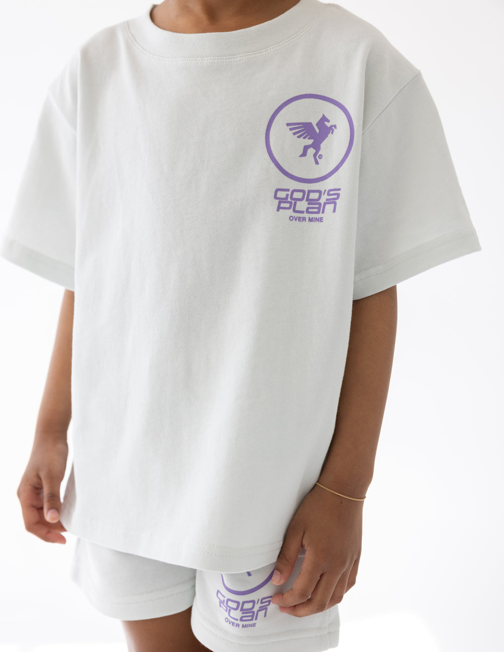 Kids racing T-shirt in white with purple chest logo and small text underneath