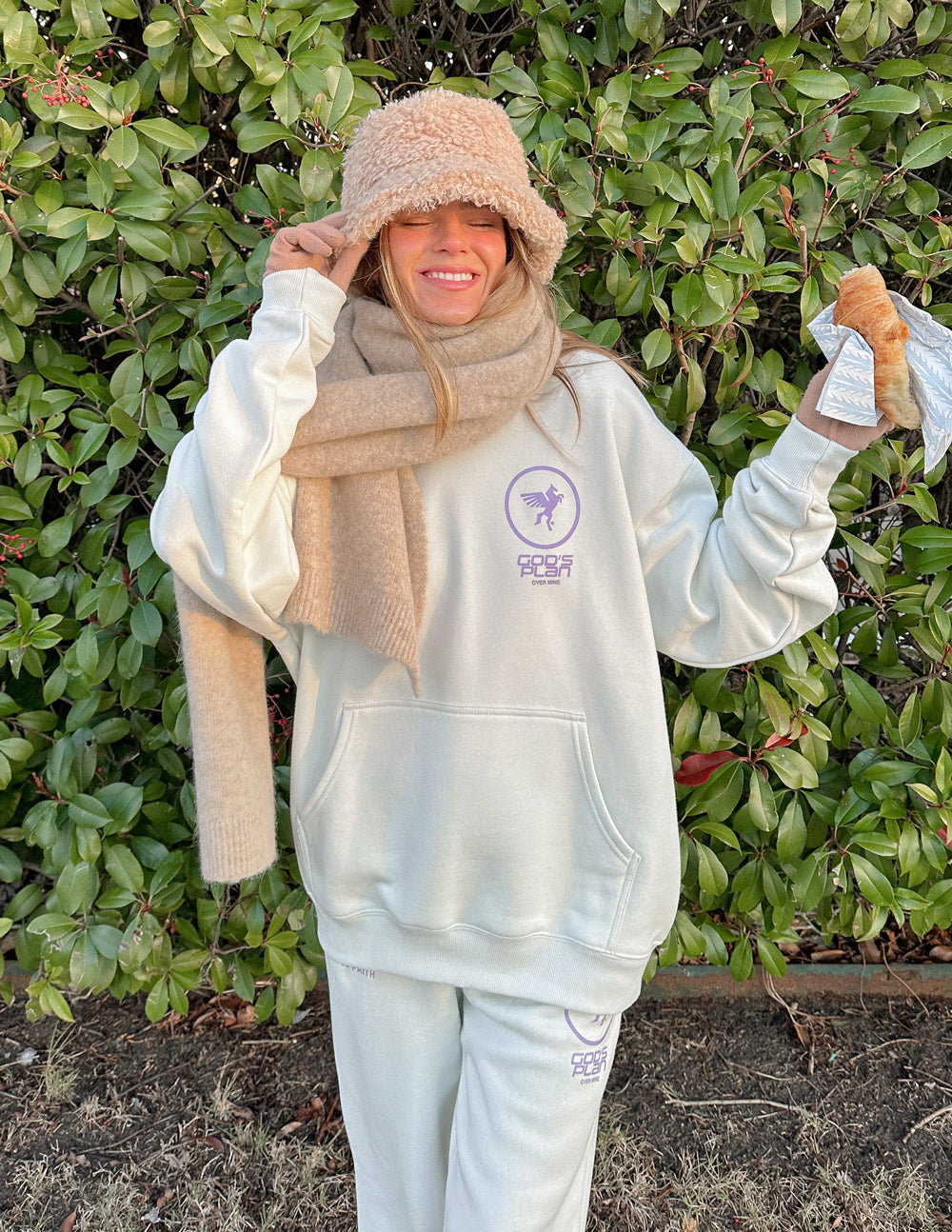 White unisex hoodie with purple front logo and front pocket