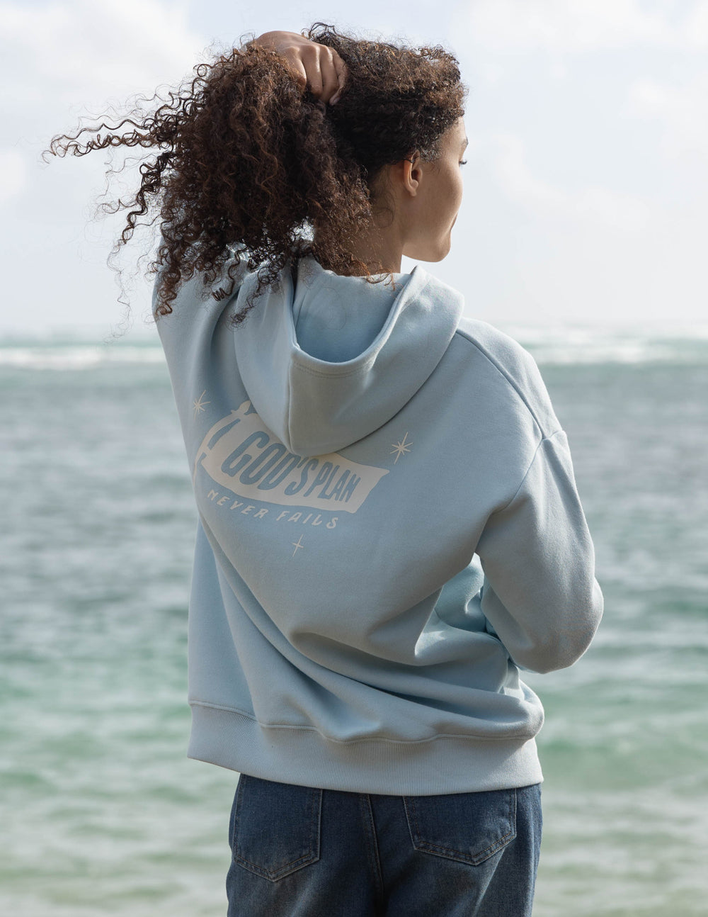 Light blue unisex hoodie, back view with large logo across shoulders