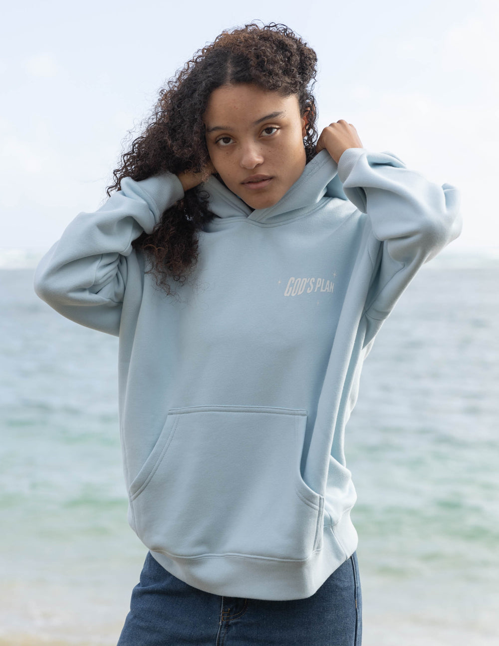 Light blue unisex hoodie with front pocket and chest logo