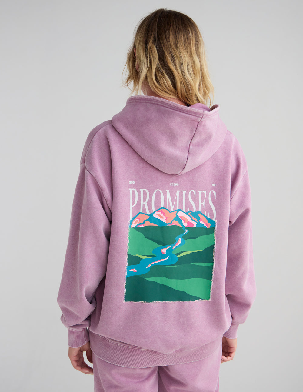 Lavender unisex hoodie rear view with hood and centered “Promises” landscape print