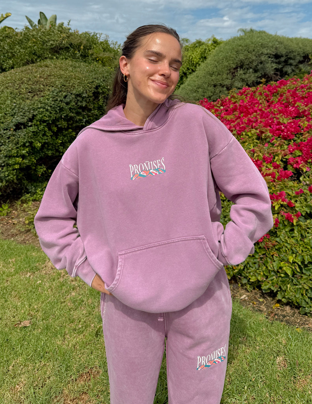 Lavender unisex hoodie with hood and front “Promises” chest graphic
