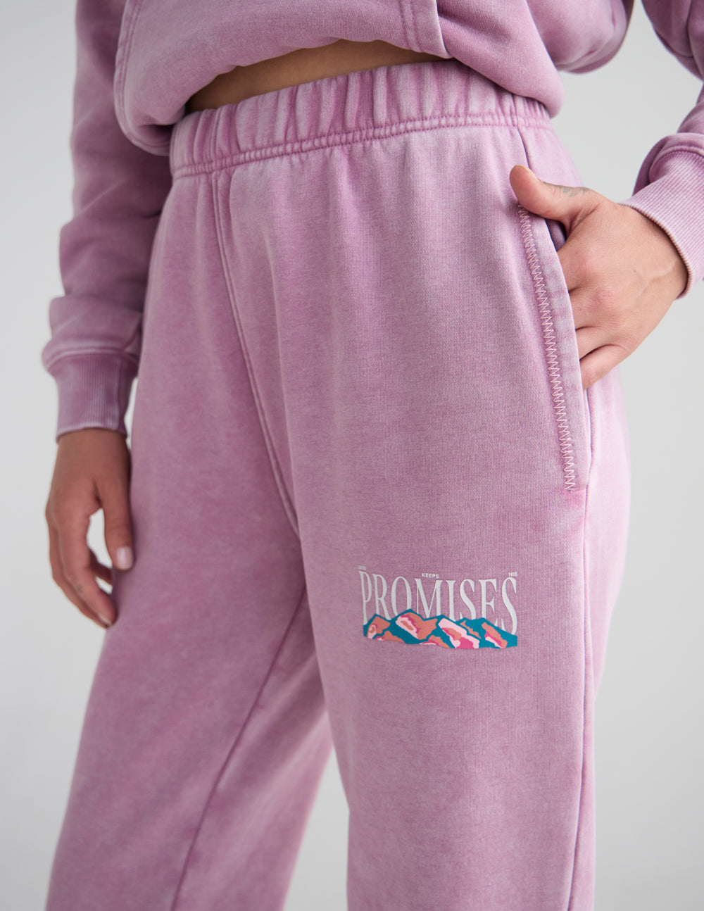 Lavender unisex sweatpants with embroidered pocket logo and drawcord detail
