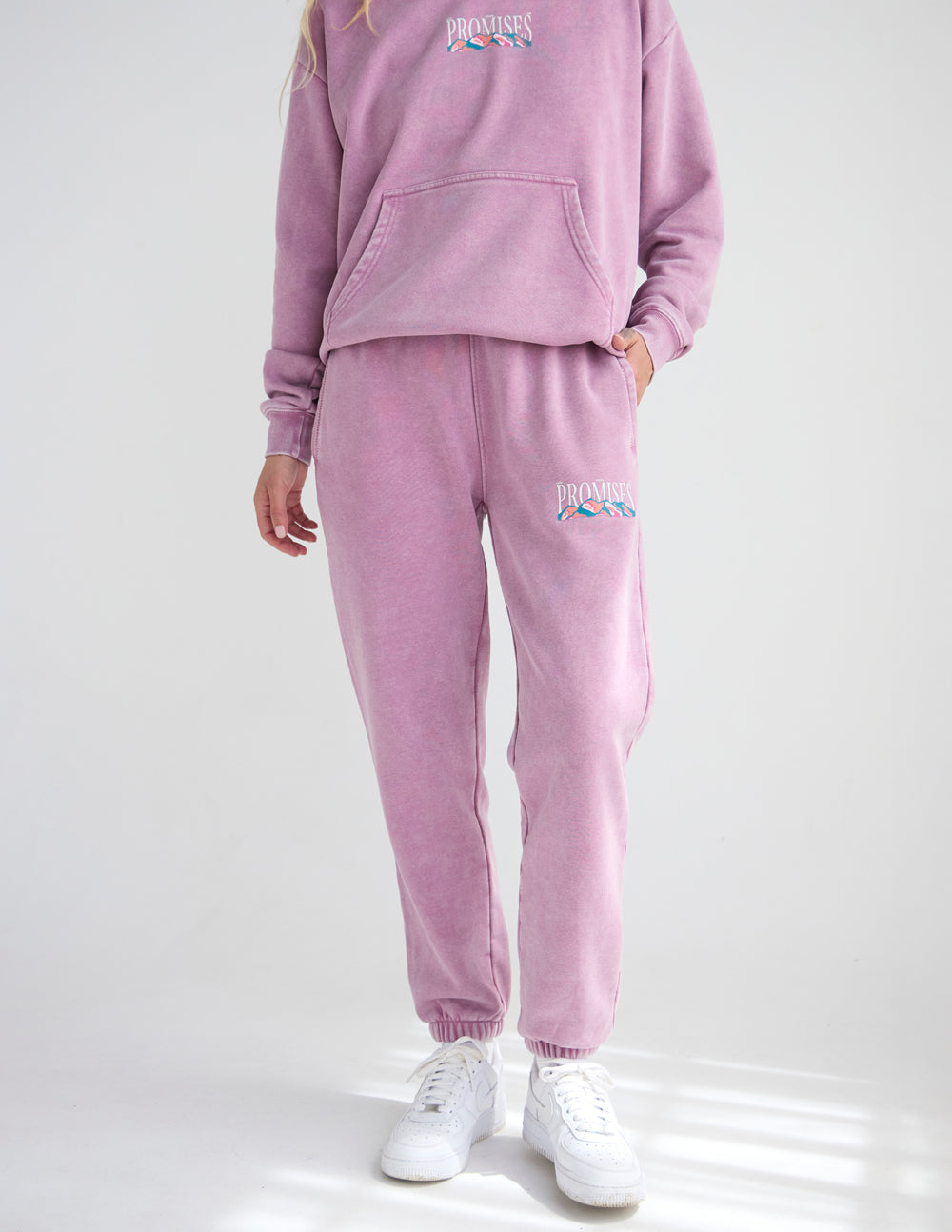 Lavender unisex sweatpants with jogger cuffs and embroidered thigh logo