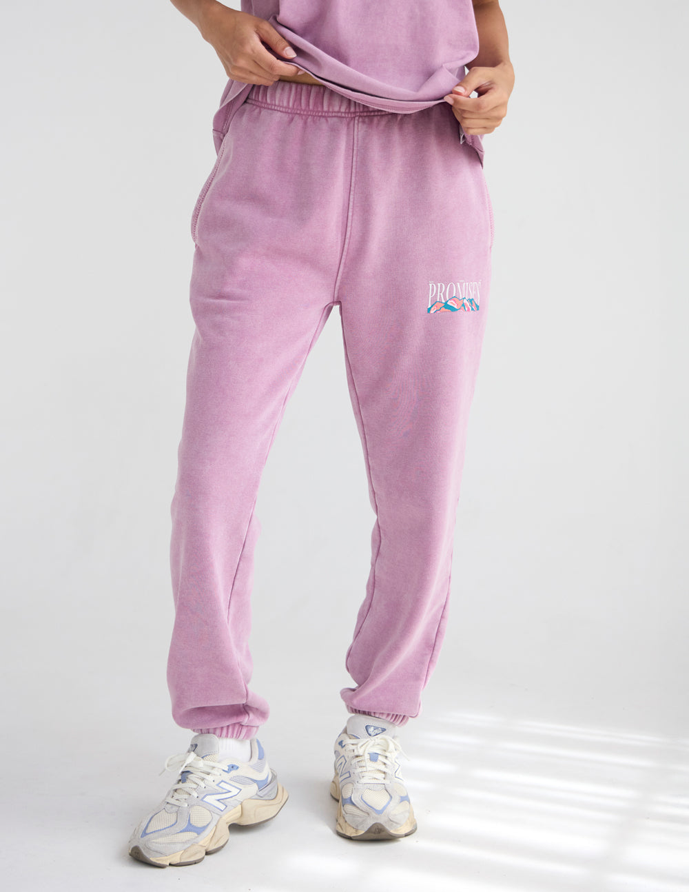 Lavender unisex sweatpants back view with elastic waistband and thigh logo