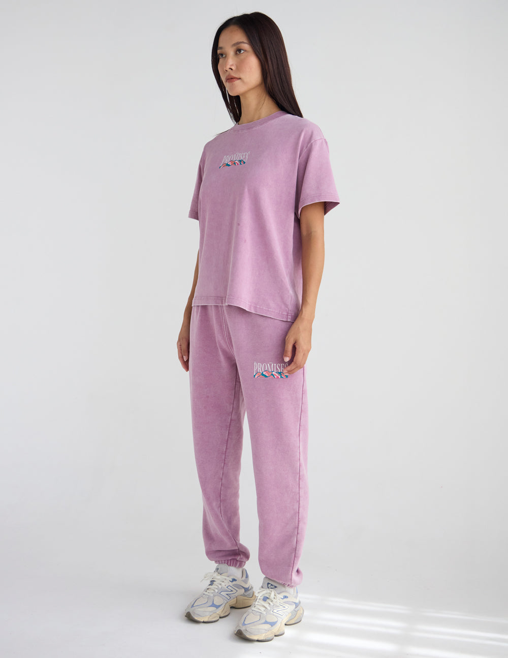 Lavender unisex sweatpants with small embroidered thigh logo and tapered jogger leg