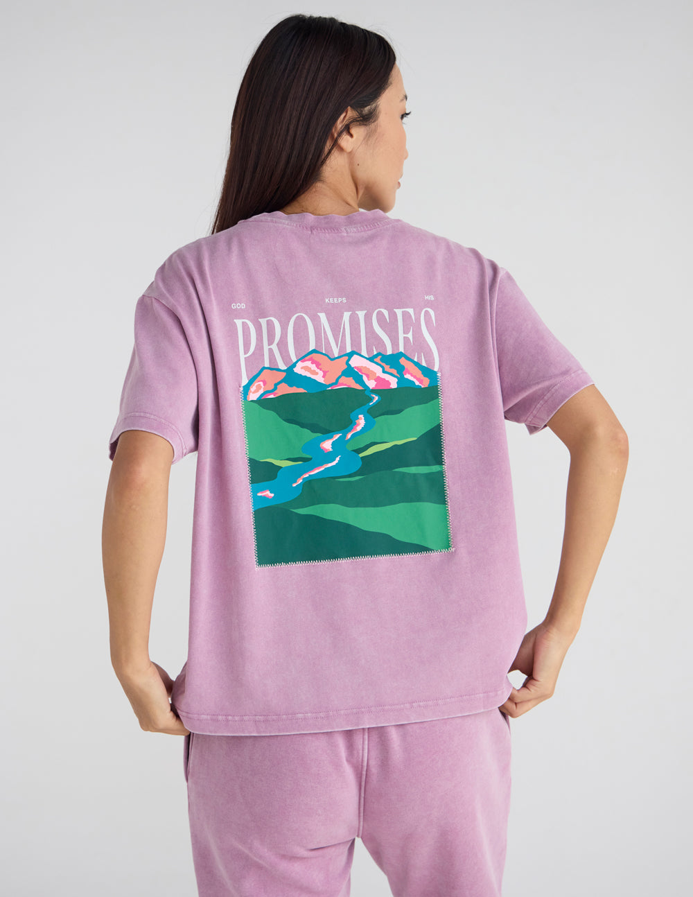 Lavender unisex T-shirt, back print with “Promises” text over landscape illustration.