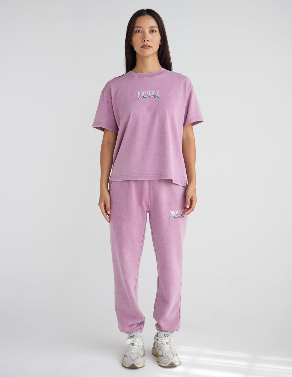 Lavender unisex T-shirt and matching sweatpants set, front chest “Promises” print.