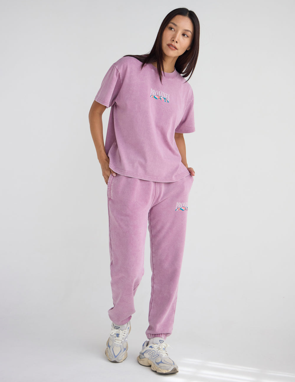 Lavender unisex T-shirt with front “Promises” print and matching sweatpants.