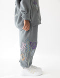 Kids gray sweatpants with embroidered flower and heart design on side leg