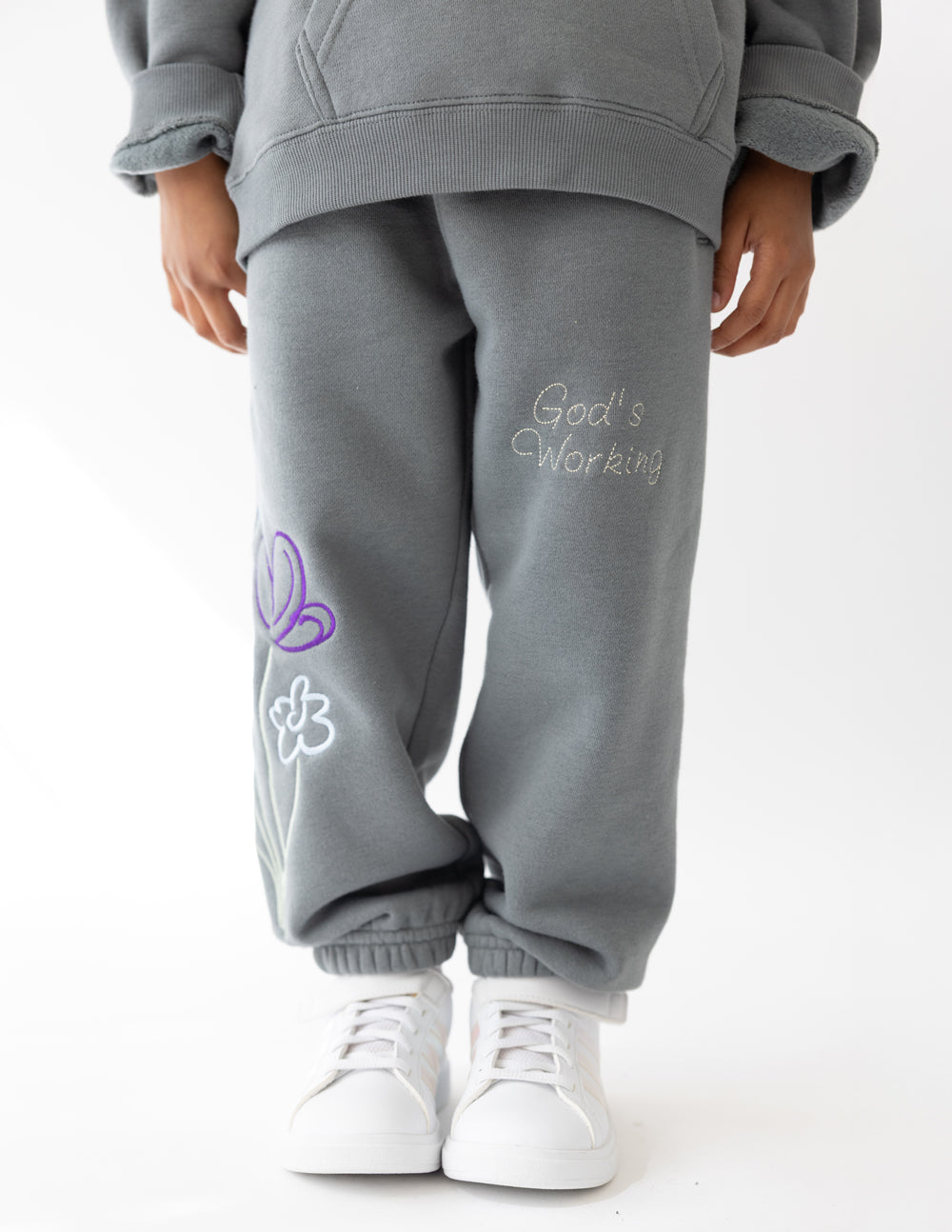 Kids gray sweatpants with heart and flower embroidery on right leg