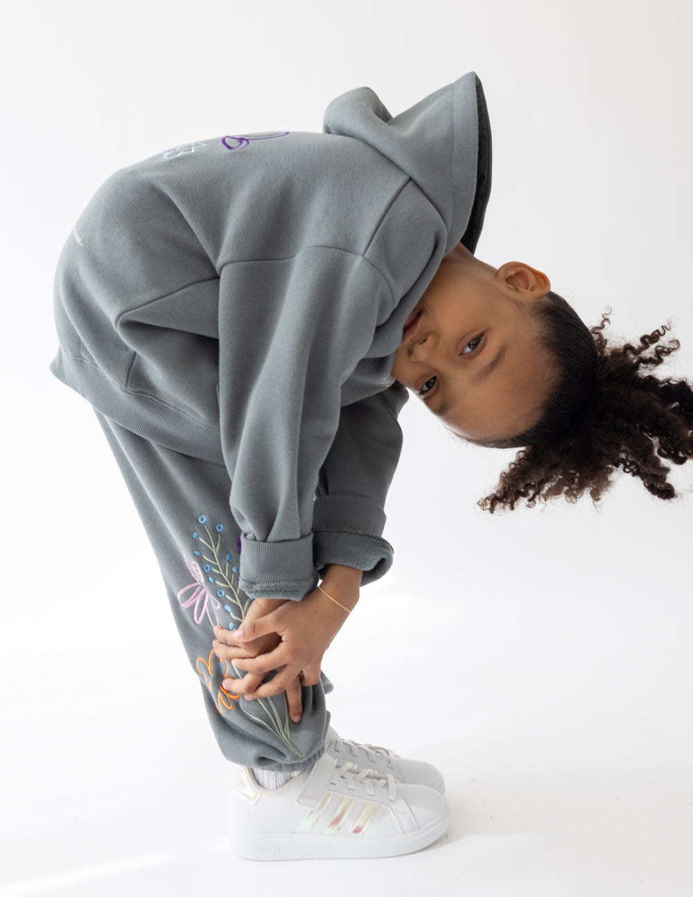 Kids gray sweatpants with embroidered heart and floral design on lower leg