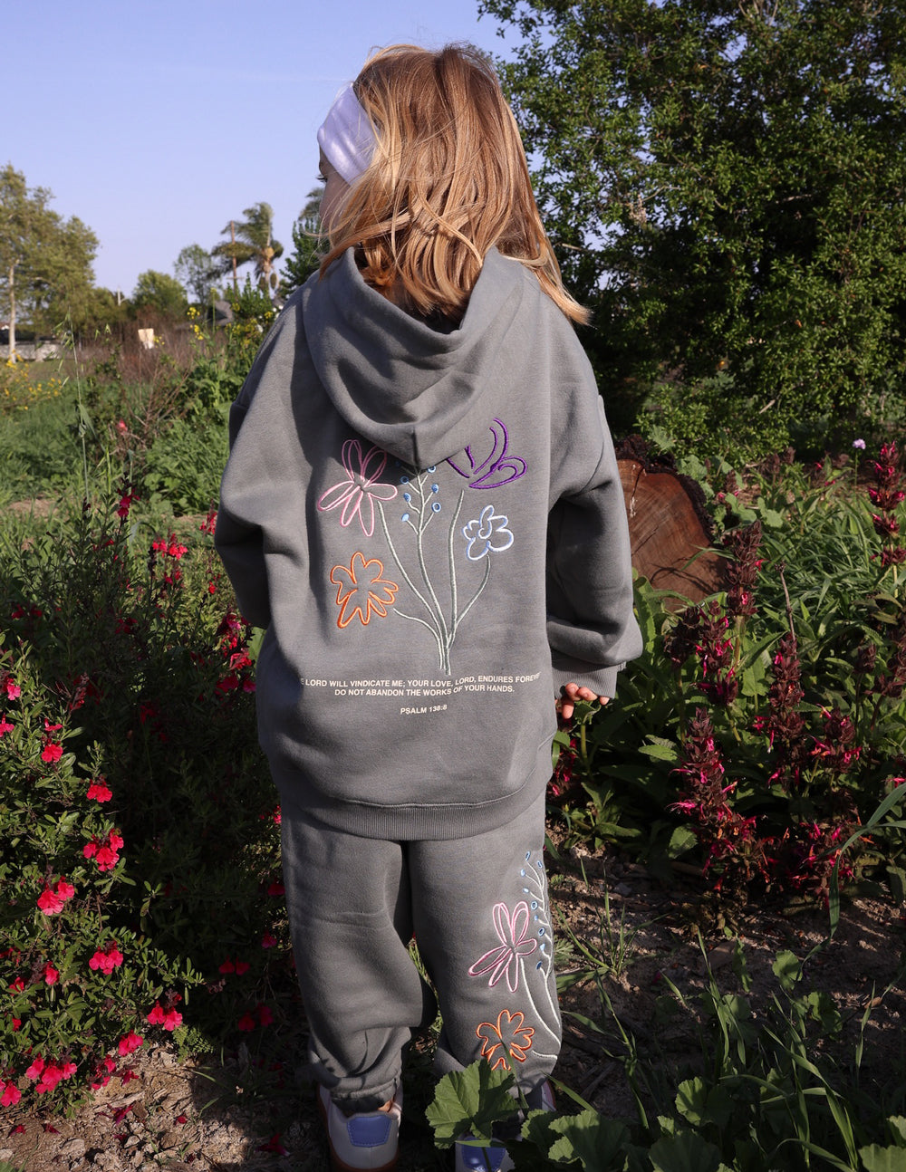 Kids gray sweatpants with embroidered flowers and hearts along side