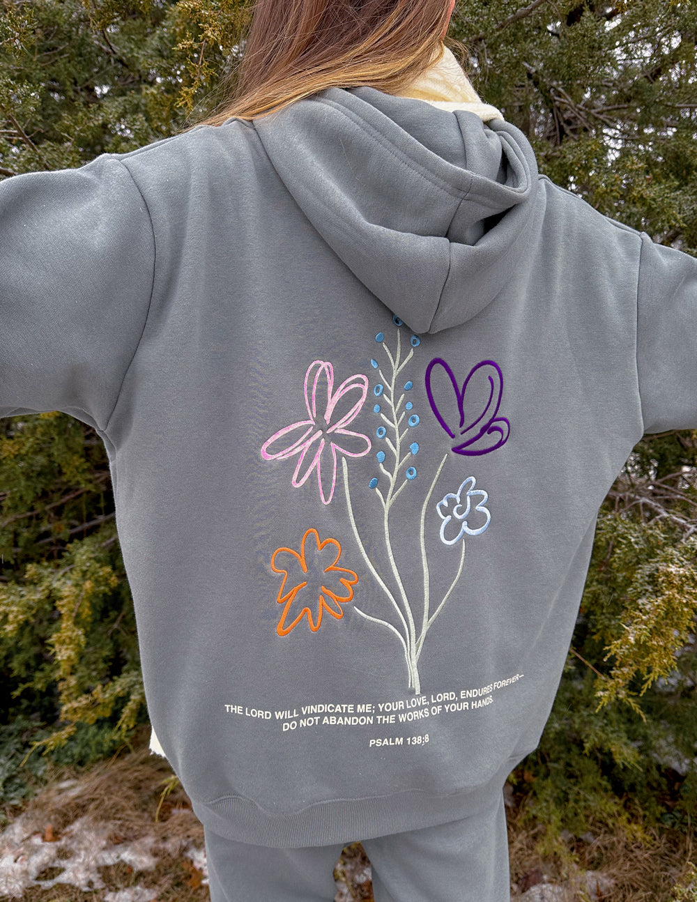 Gray unisex hoodie with large colorful flower bouquet graphic on the back.