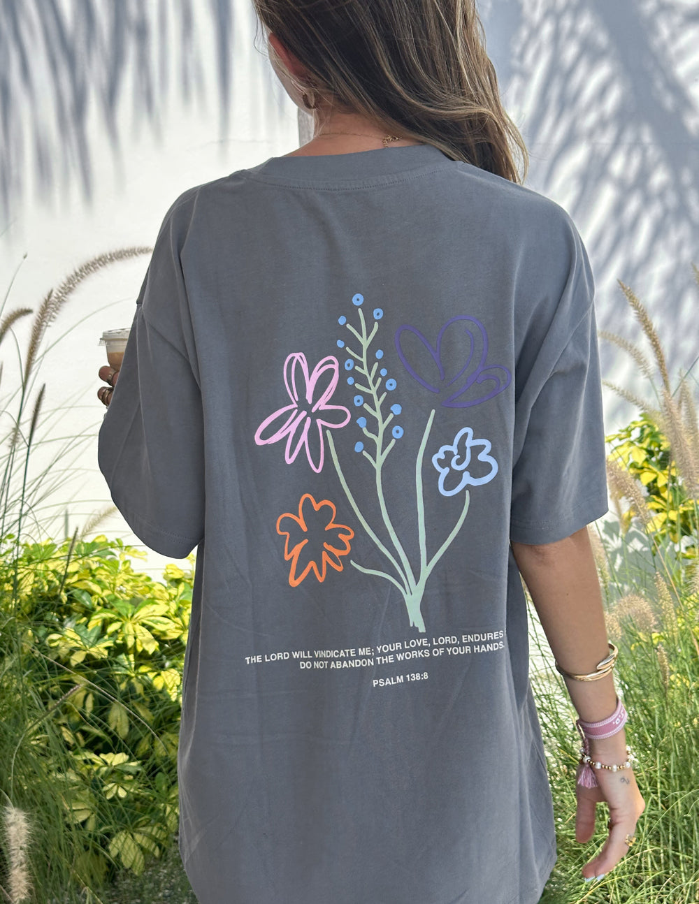 Unisex heather-gray tee with back floral bouquet graphic and script text