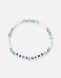 Letter bead bracelet with white beads and “GOOD NEWS” text in blue and gold