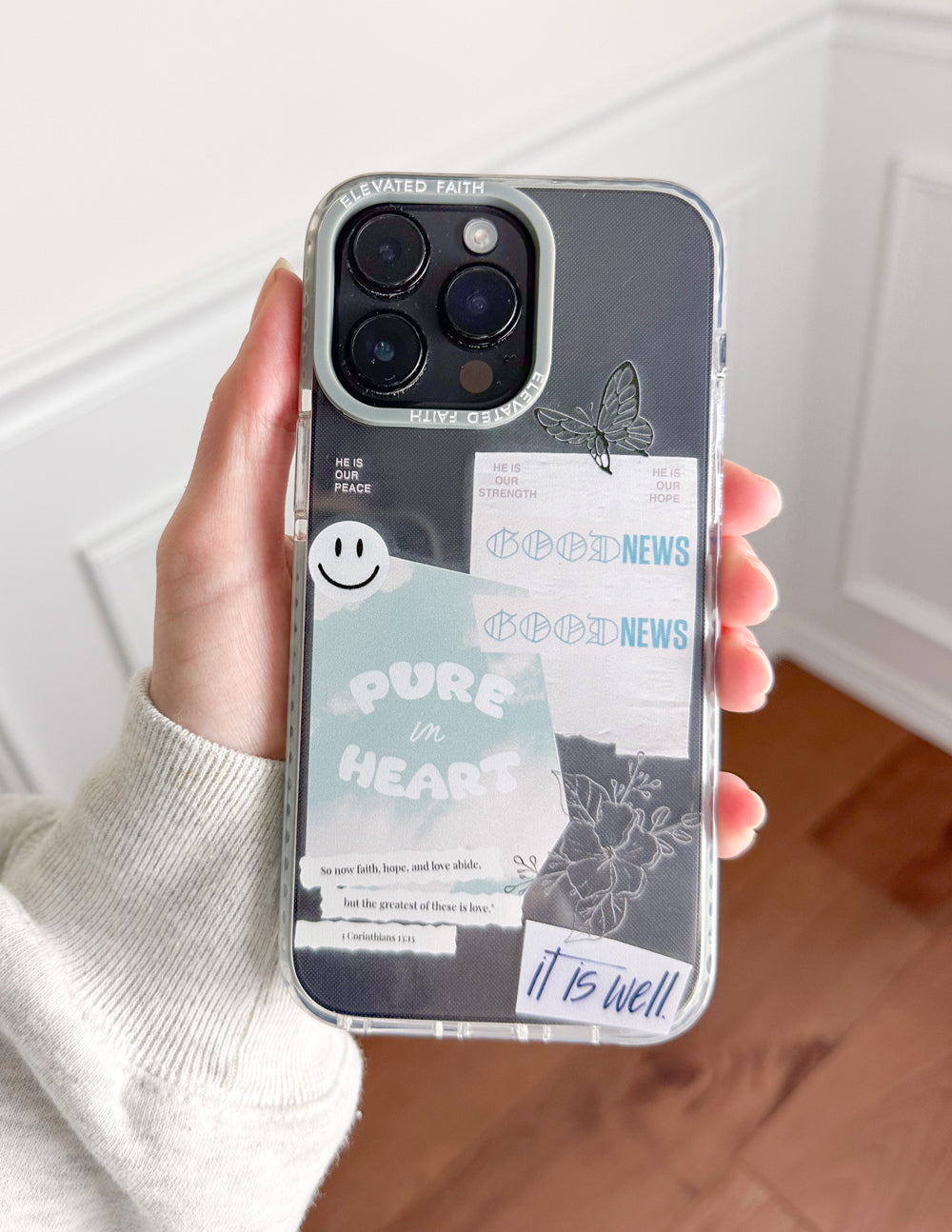Transparent phone case with light blue border, butterfly and faith quote 'It is well'