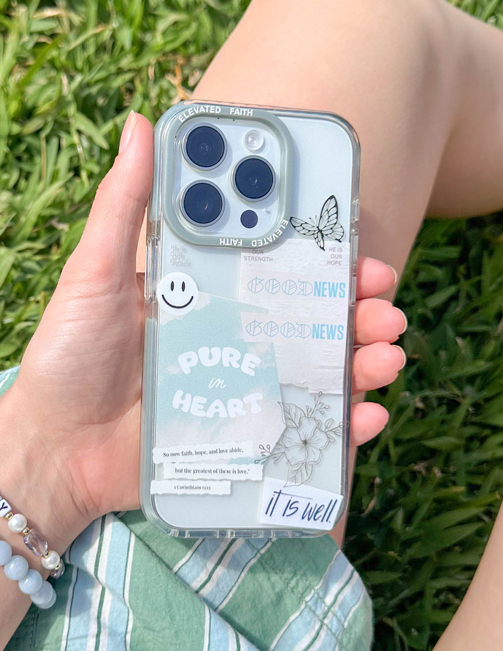 Transparent phone case with light blue border, butterfly and 'PURE in HEART' wording