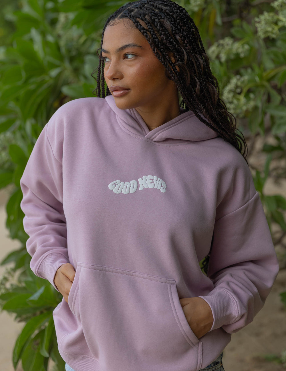 Dusty pink unisex hoodie with front logo graphic and kangaroo pocket