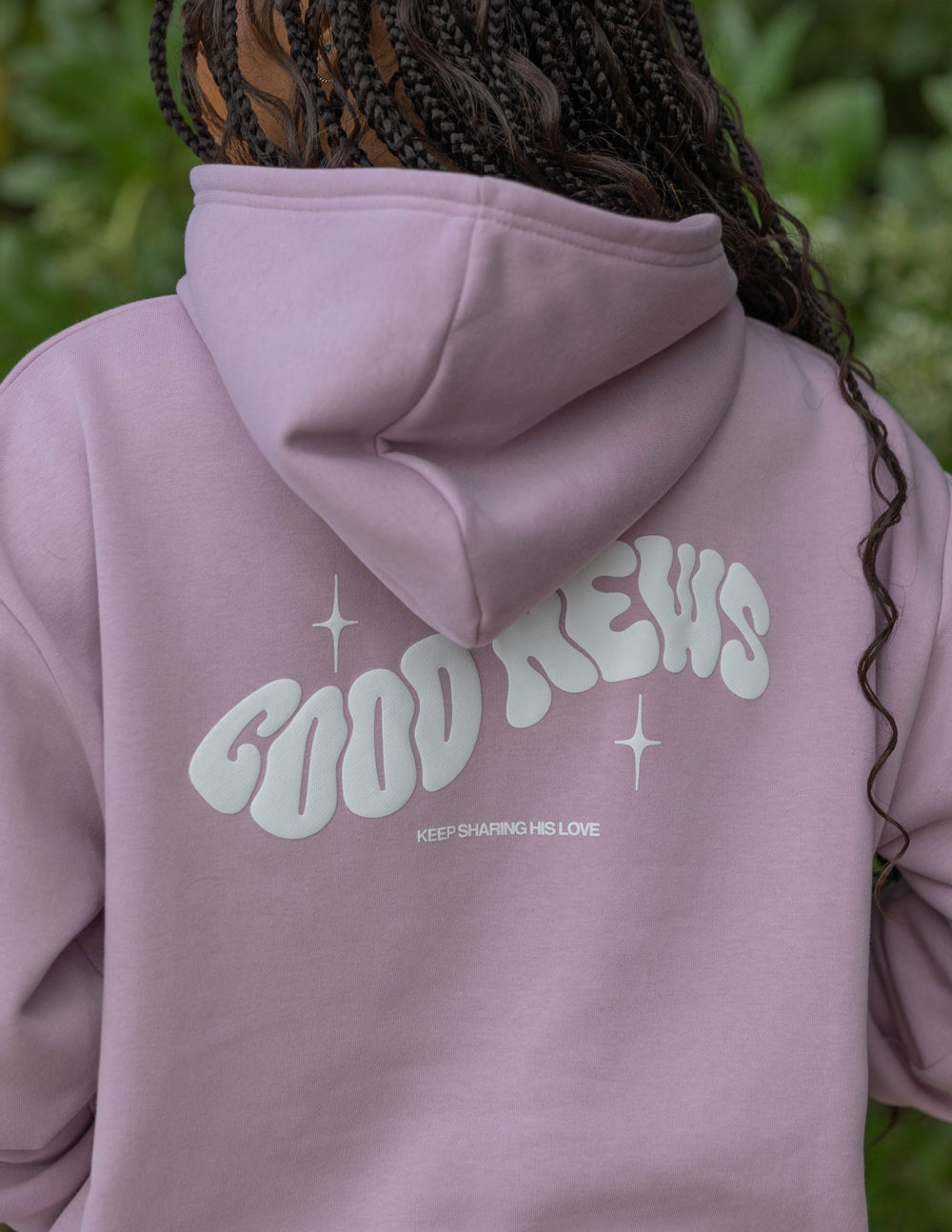 Dusty pink unisex hoodie back with large Good News logo and stars