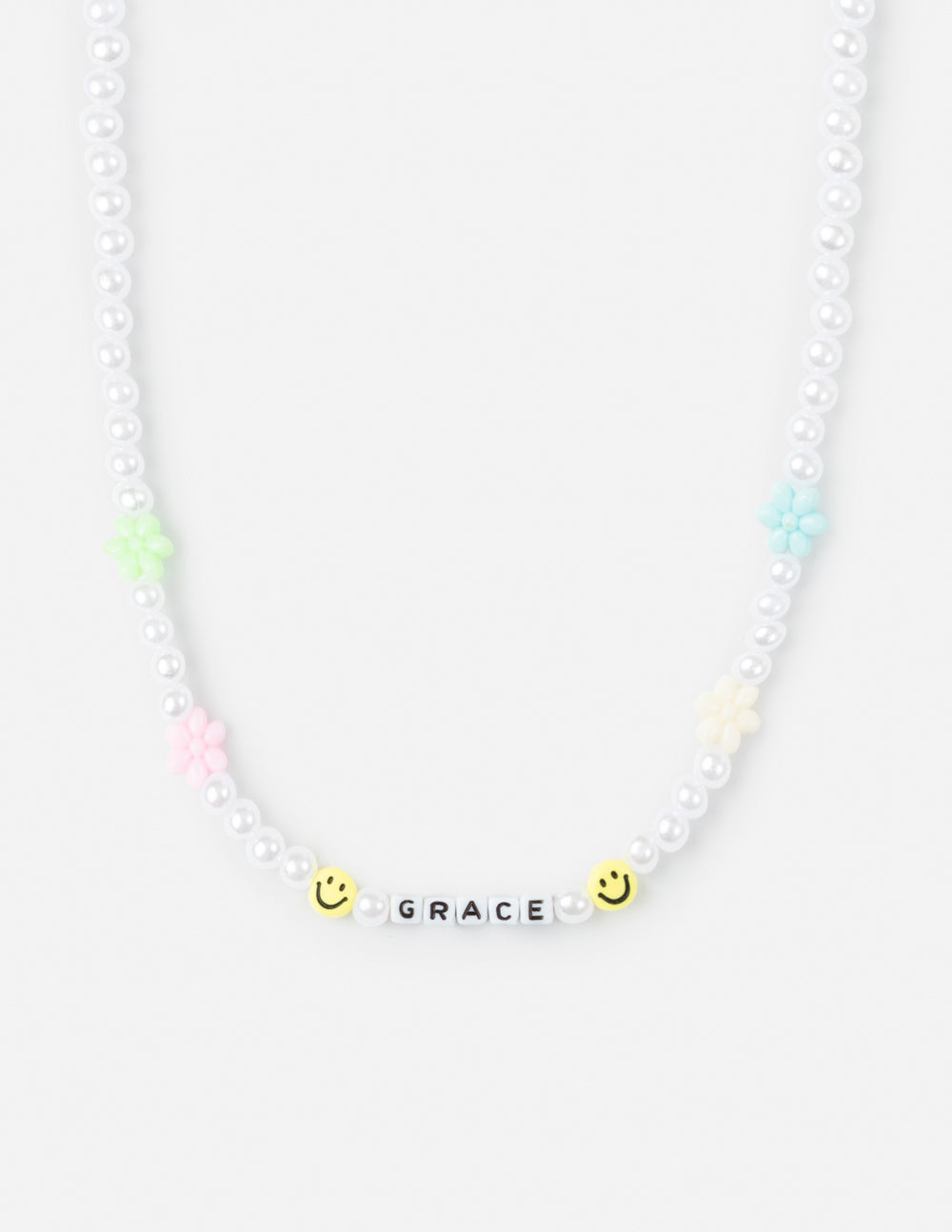 Grace letter necklace with white pearl beads, “GRACE” charm, and pastel smiley accents