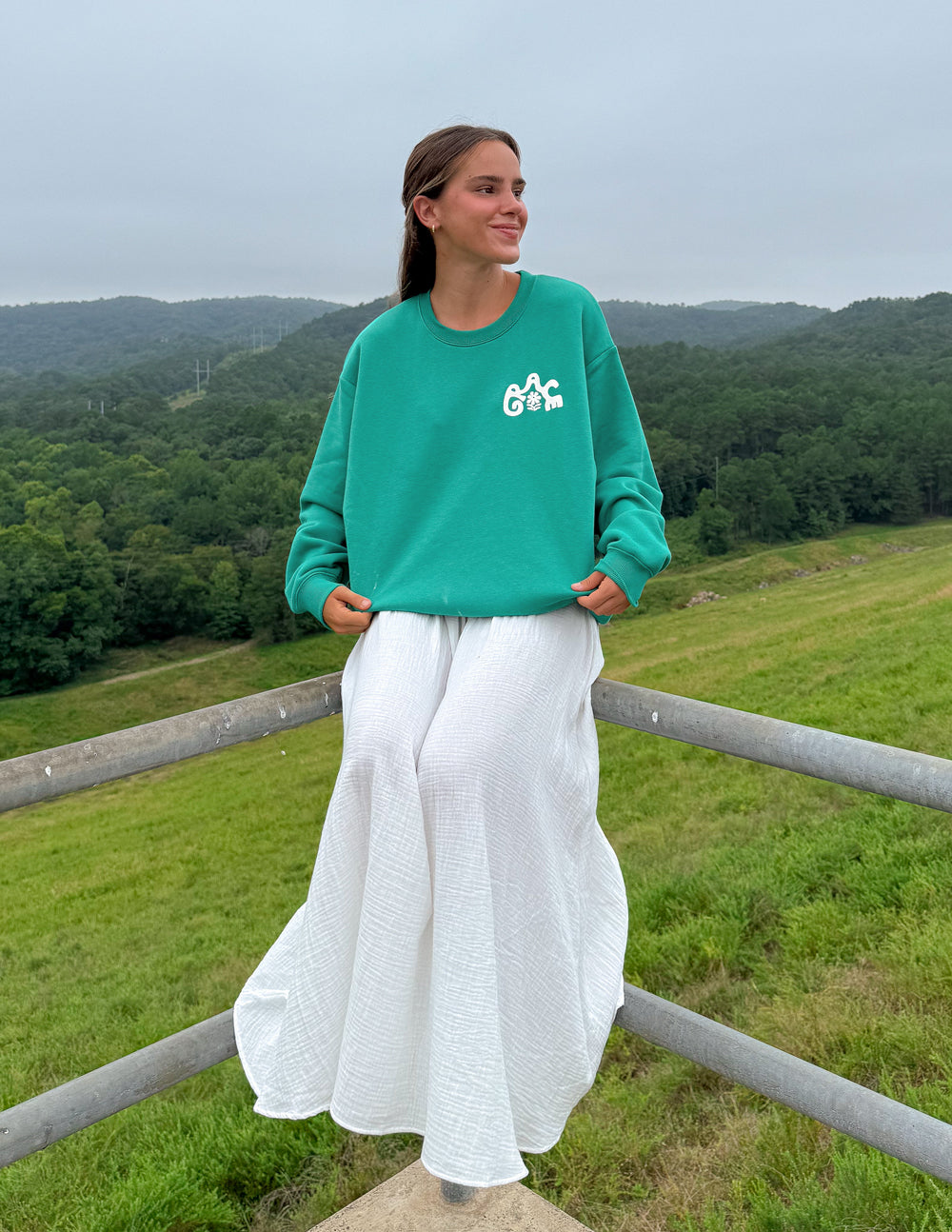 Green unisex crewneck sweatshirt, front logo on chest