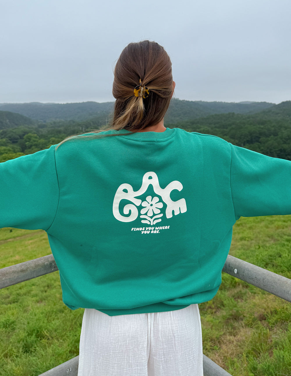 Green unisex crewneck sweatshirt, centered back elephant floral logo