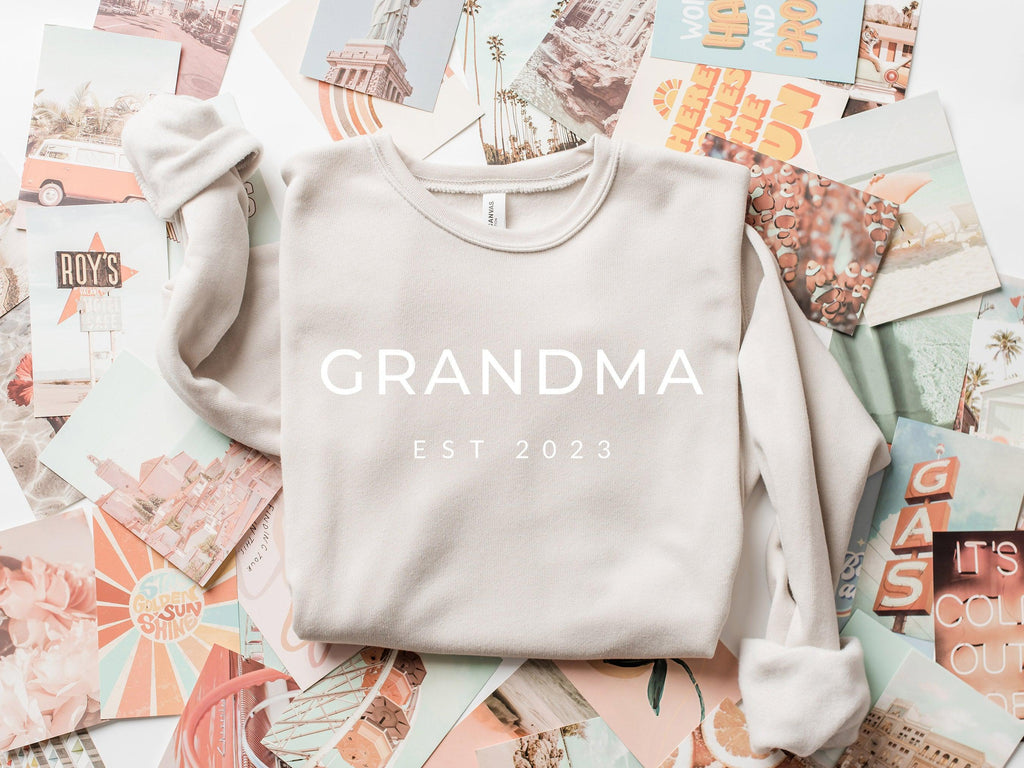 Cream sponge fleece sweatshirt with 'GRANDMA EST 2023' front print