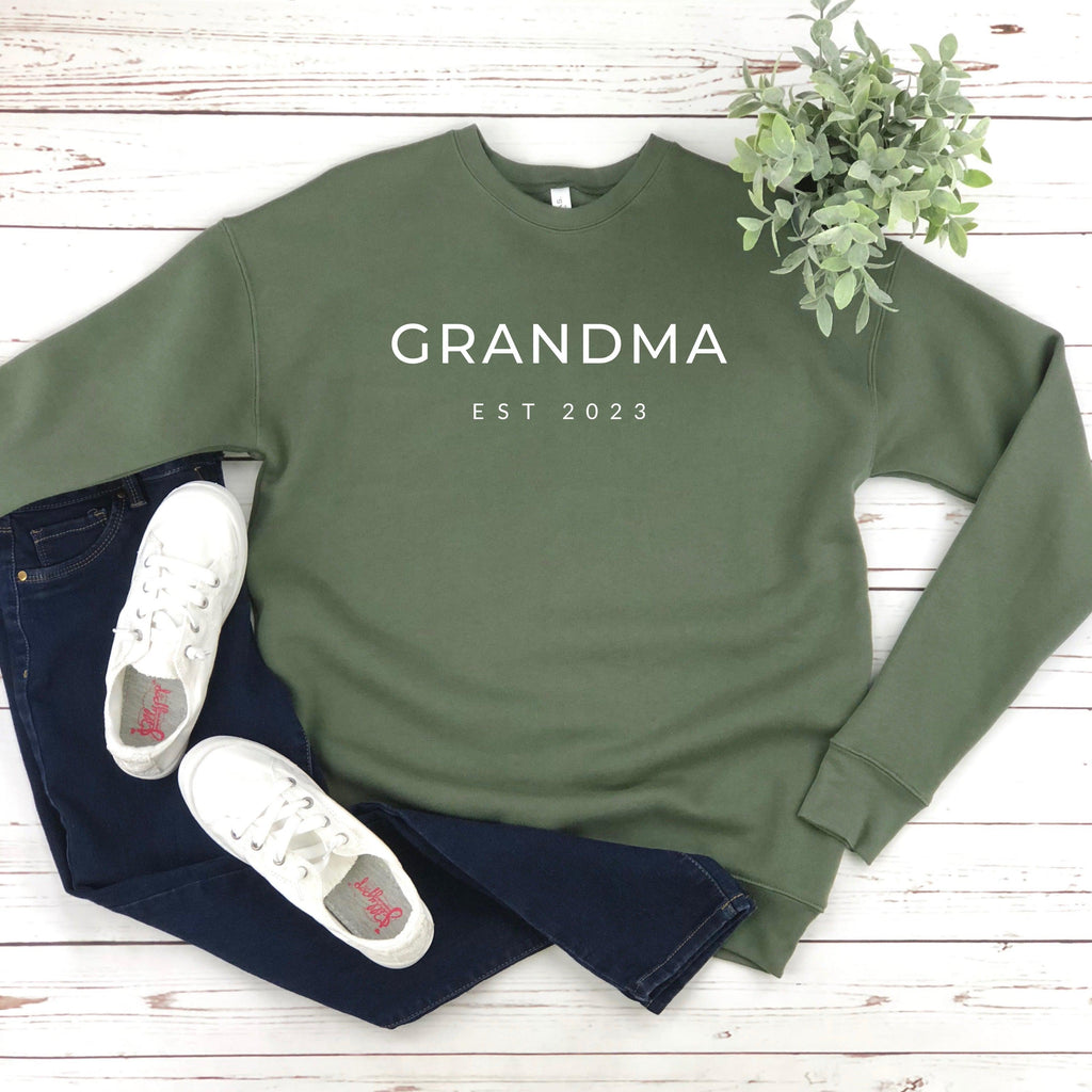 Olive green sponge fleece sweatshirt with 'GRANDMA EST 2023' front print