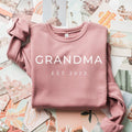 Dusty mauve sponge fleece sweatshirt with 'GRANDMA EST 2023' front print