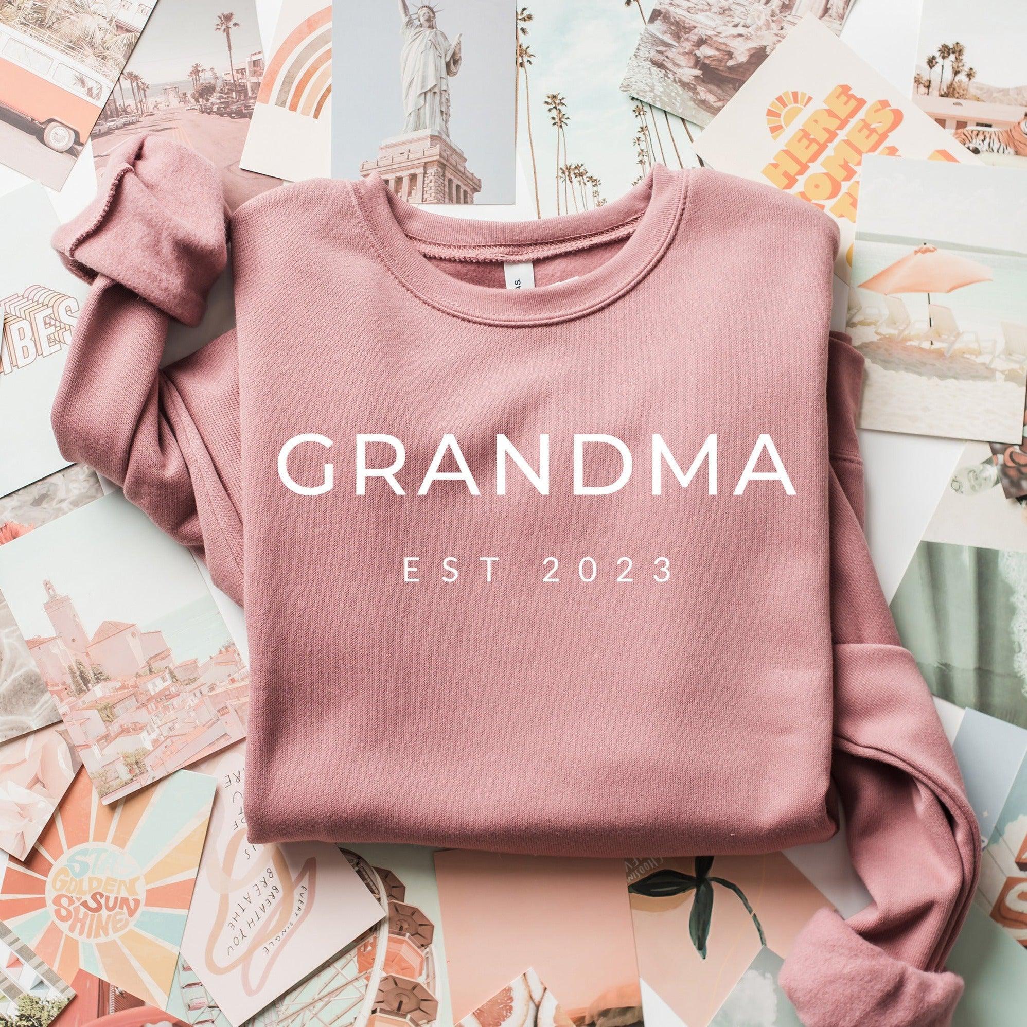 Dusty mauve sponge fleece sweatshirt with 'GRANDMA EST 2023' front print