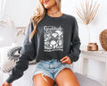 Dark gray long-sleeve T-shirt with white “Gratitude” and botanical “Changes Everything” print