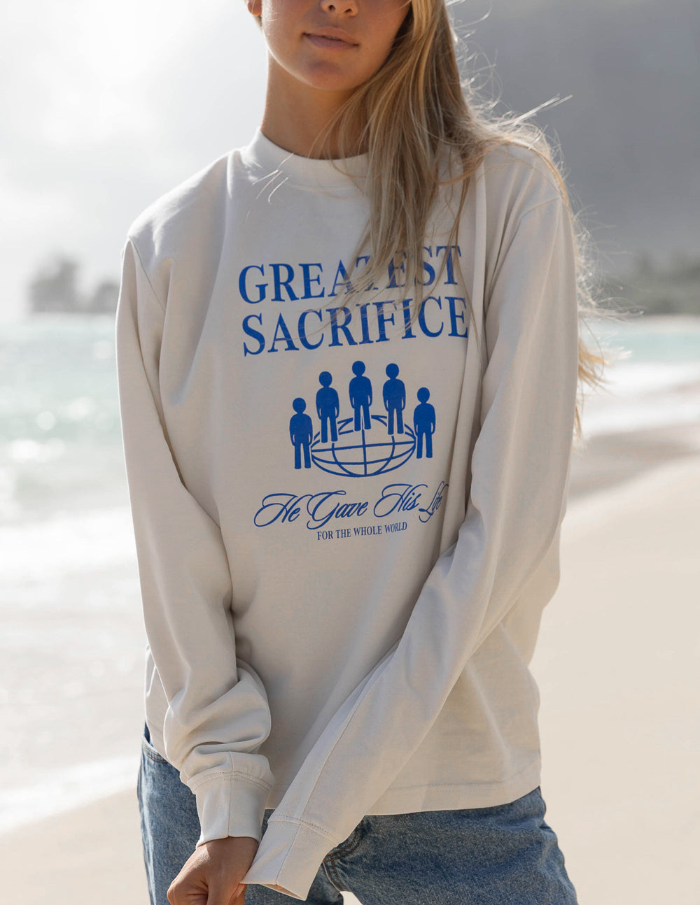 White long-sleeve unisex T-shirt with blue “Greatest Sacrifice” front print