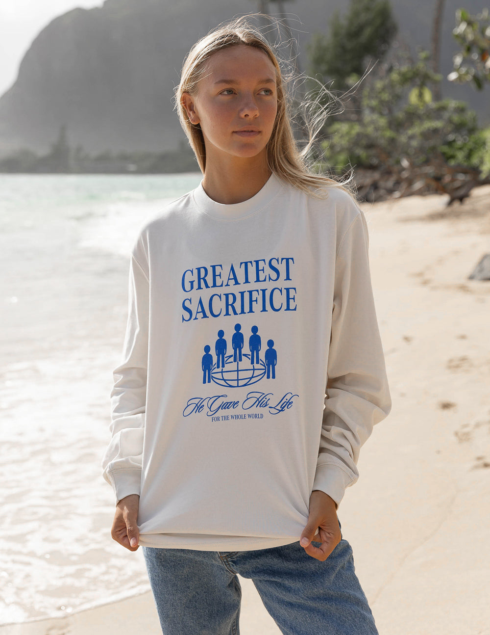 White long-sleeve unisex T-shirt with blue “Greatest Sacrifice” graphic and crew neck