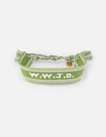 Green embroidered bracelet with tassels and a small charm