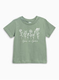 Kids organic cotton T-shirt in thyme green with white wildflower graphic and Grow in Grace text.