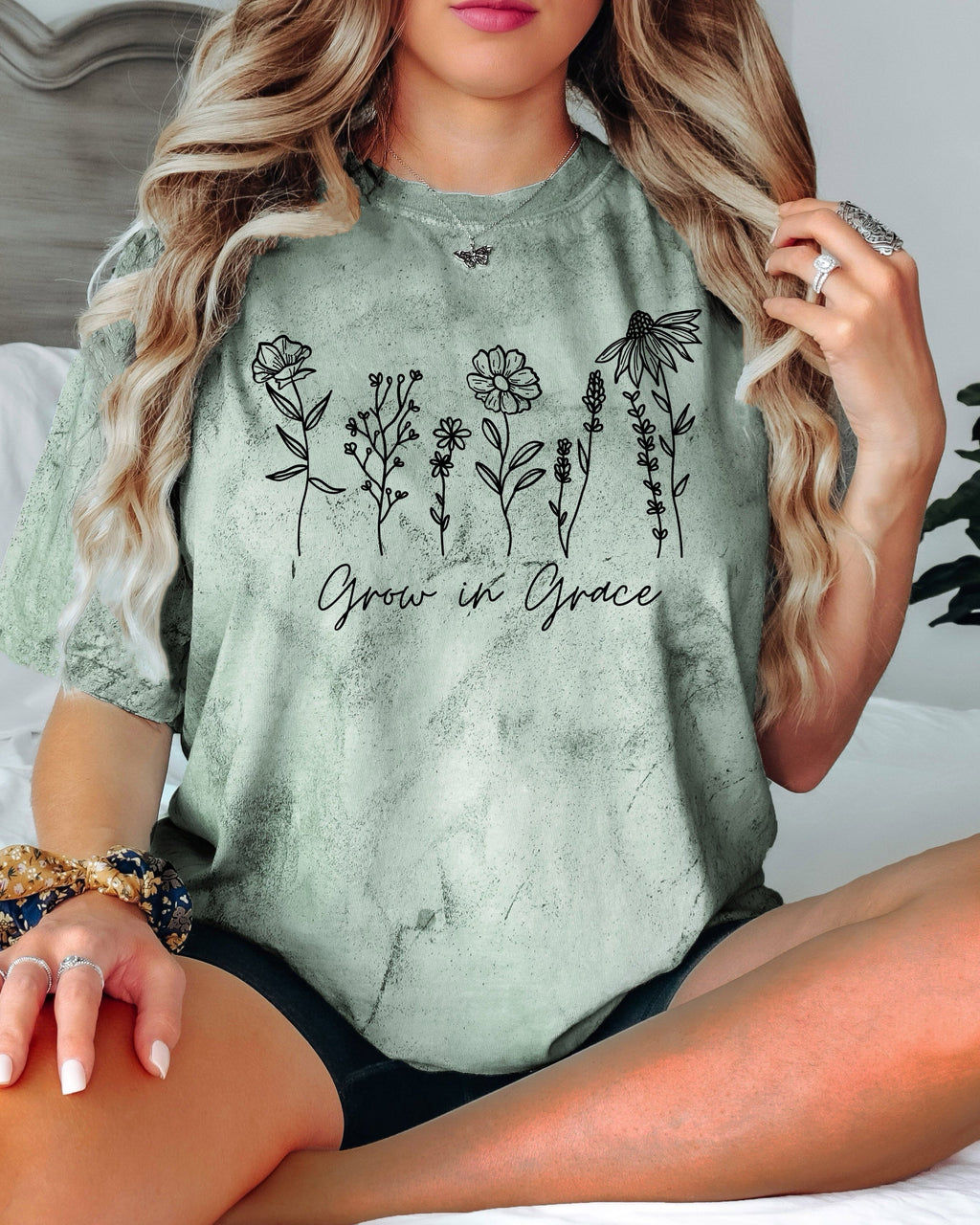 Olive green T-shirt with floral 'Grow in Grace' graphic