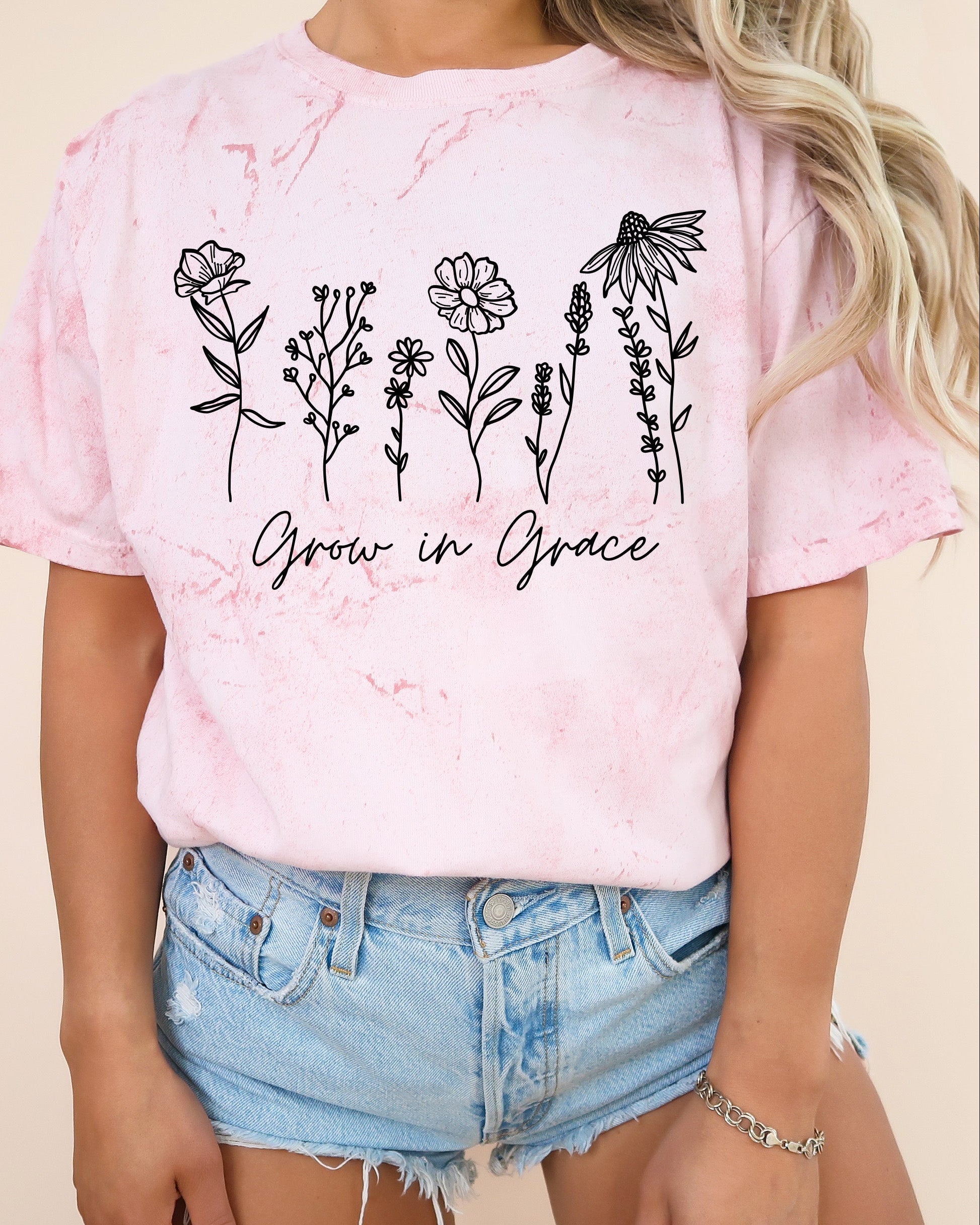 Pink T-shirt with floral 'Grow in Grace' graphic