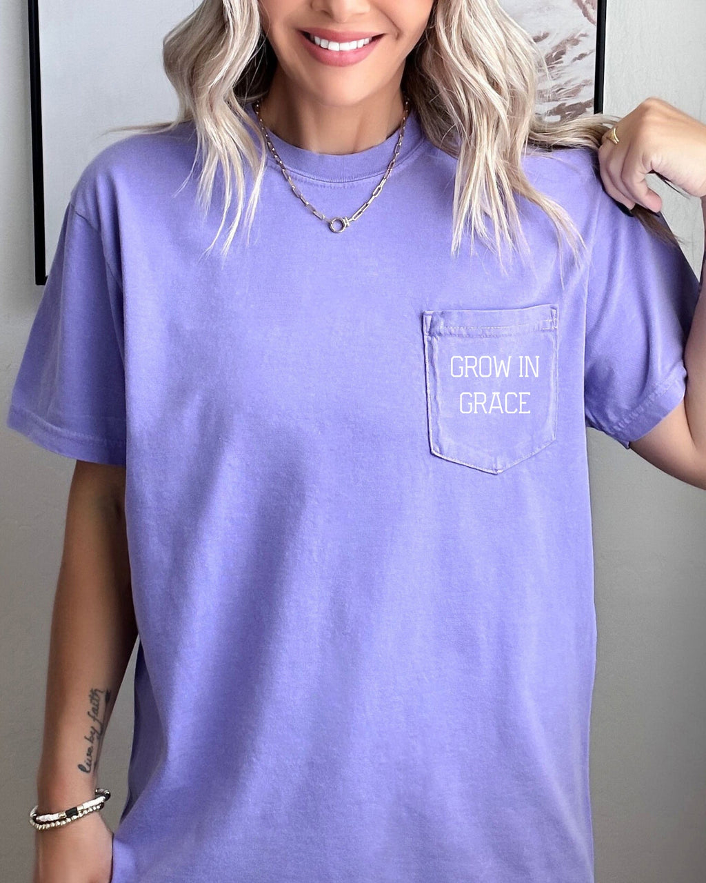Women's lavender pocket T-shirt with 'Grow in Grace' text graphic