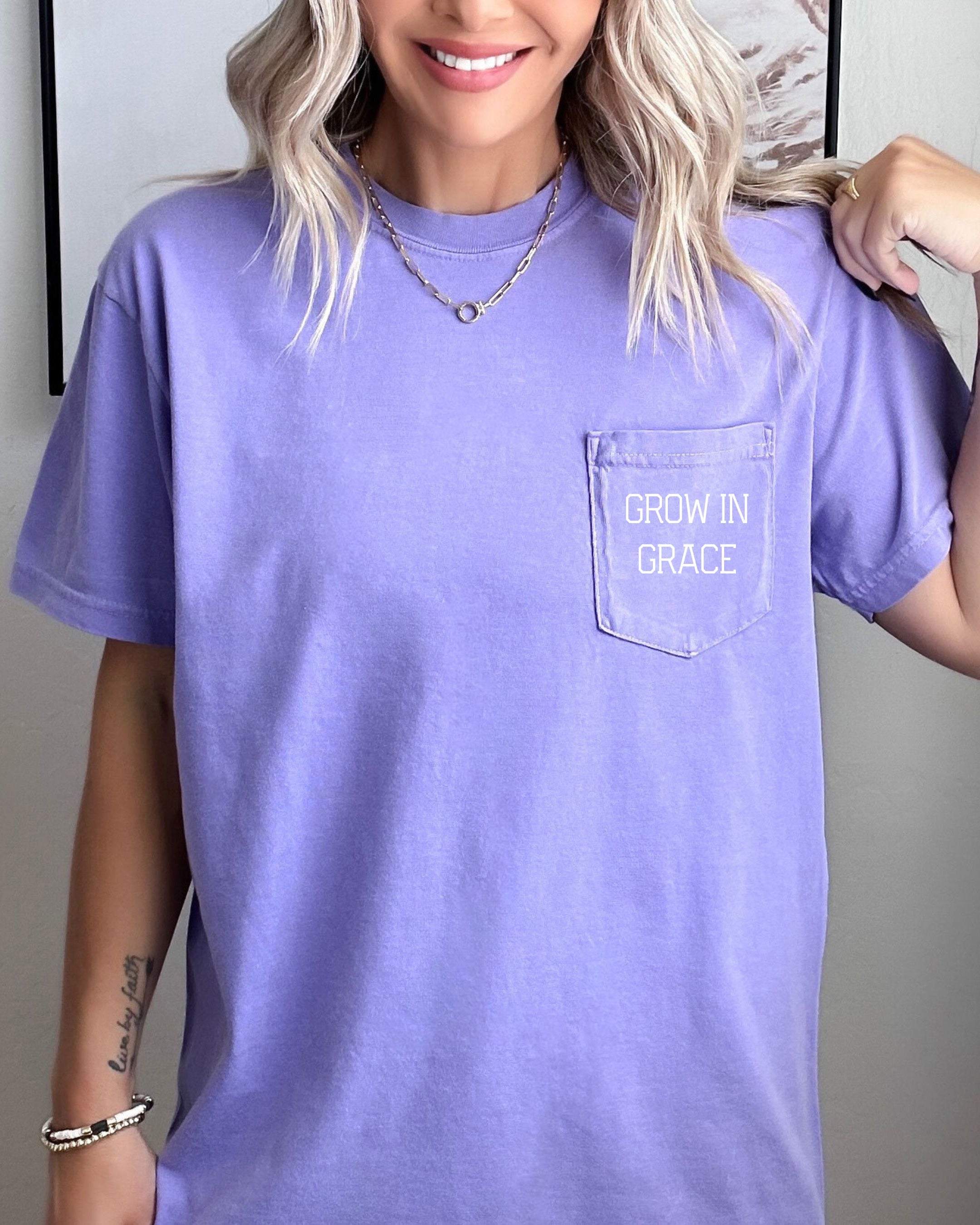 Women's lavender pocket T-shirt with 'Grow in Grace' text graphic