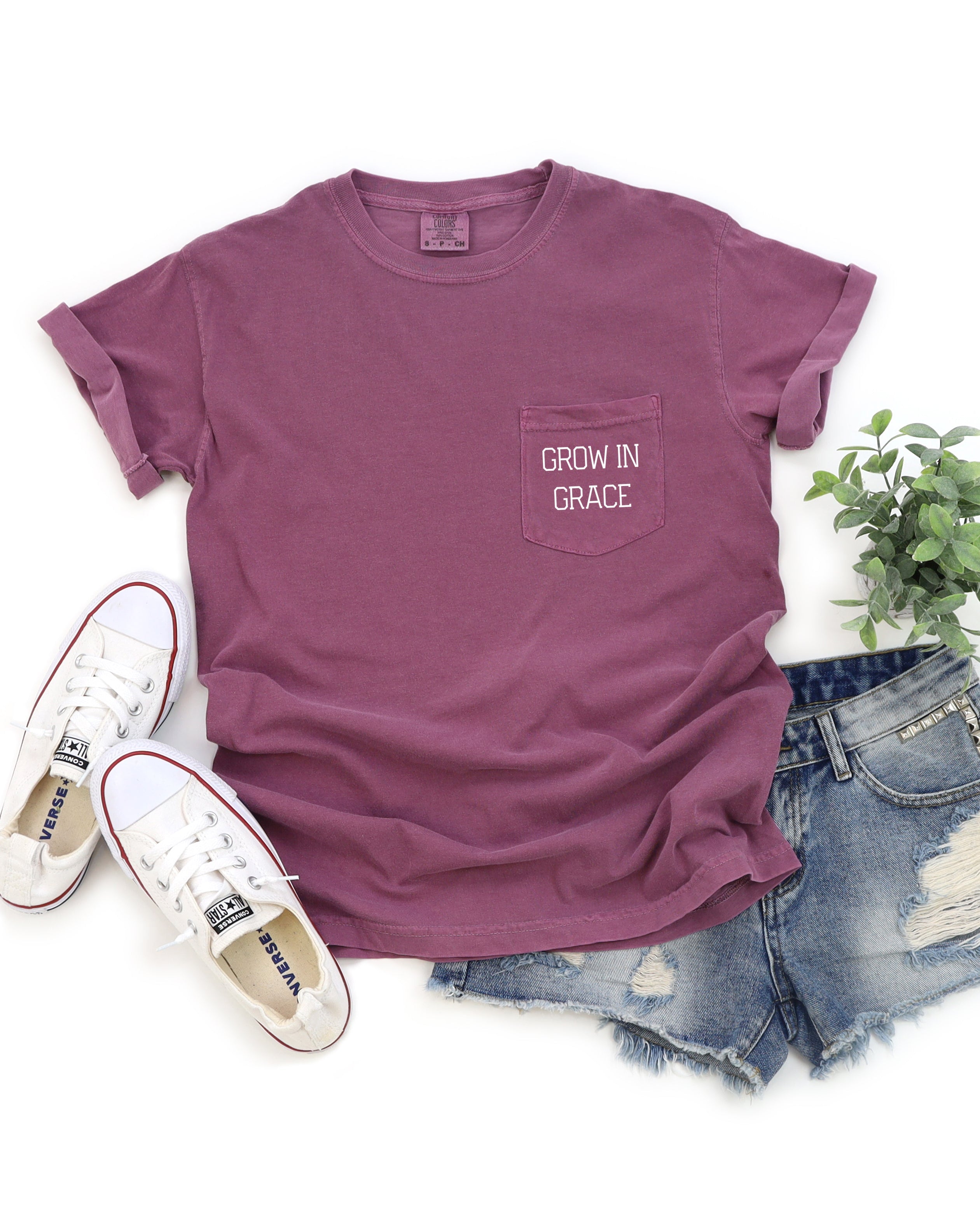 Mauve pocket t-shirt with "Grow in Grace" chest graphic.